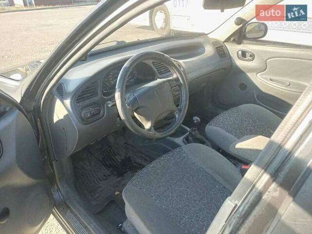 Чорний Деу Ланос, об'ємом двигуна 1.5 л та пробігом 184 тис. км за 3000 $, фото 4 на Automoto.ua