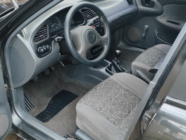 Черный Дэу Ланос, объемом двигателя 1.5 л и пробегом 130 тыс. км за 2700 $, фото 5 на Automoto.ua