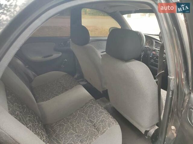 Черный Дэу Ланос, объемом двигателя 1.5 л и пробегом 237 тыс. км за 2100 $, фото 1 на Automoto.ua