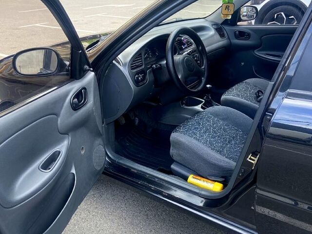 Черный Дэу Ланос, объемом двигателя 1.5 л и пробегом 171 тыс. км за 3150 $, фото 3 на Automoto.ua