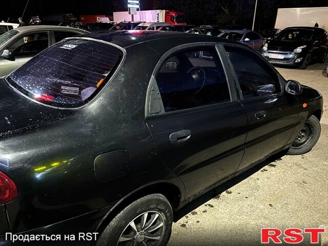 Черный Дэу Ланос, объемом двигателя 1.5 л и пробегом 292 тыс. км за 2300 $, фото 3 на Automoto.ua