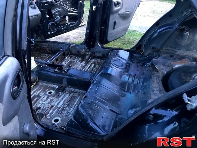 Черный Дэу Ланос, объемом двигателя 1.5 л и пробегом 368 тыс. км за 1150 $, фото 7 на Automoto.ua