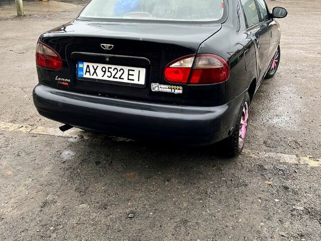 Черный Дэу Ланос, объемом двигателя 1.4 л и пробегом 202 тыс. км за 1400 $, фото 2 на Automoto.ua