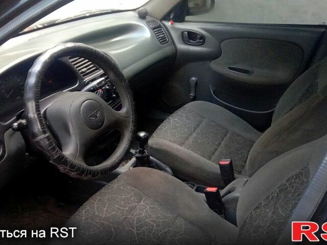 Черный Дэу Ланос, объемом двигателя 1.5 л и пробегом 276 тыс. км за 2000 $, фото 5 на Automoto.ua