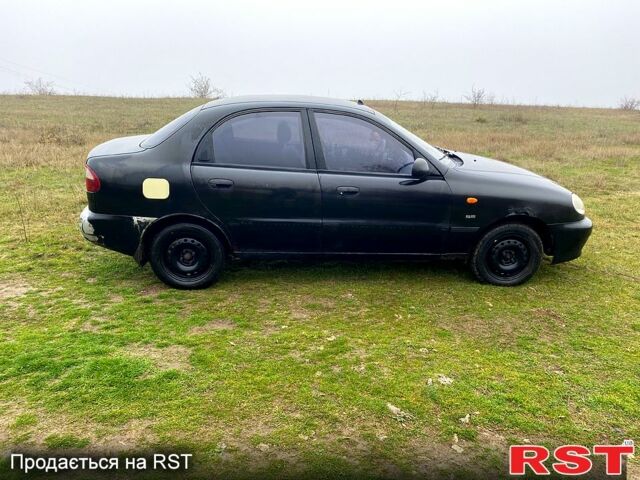 Чорний Деу Ланос, об'ємом двигуна 1.5 л та пробігом 256 тис. км за 1100 $, фото 3 на Automoto.ua