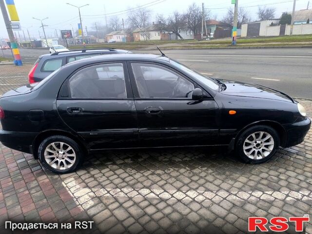 Черный Дэу Ланос, объемом двигателя 1.5 л и пробегом 220 тыс. км за 1000 $, фото 1 на Automoto.ua