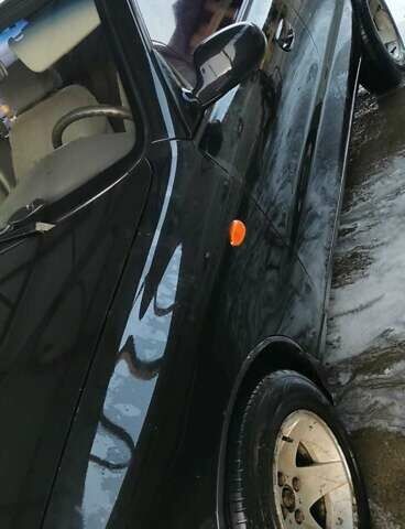 Черный Дэу Ланос, объемом двигателя 1.3 л и пробегом 160 тыс. км за 2000 $, фото 3 на Automoto.ua