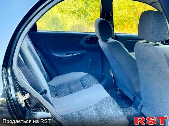 Черный Дэу Ланос, объемом двигателя 1.4 л и пробегом 303 тыс. км за 1199 $, фото 7 на Automoto.ua