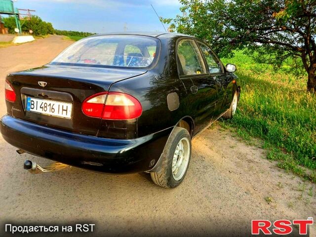 Черный Дэу Ланос, объемом двигателя 1.5 л и пробегом 368 тыс. км за 1150 $, фото 4 на Automoto.ua