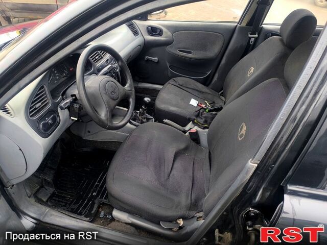 Черный Дэу Ланос, объемом двигателя 1.5 л и пробегом 220 тыс. км за 1000 $, фото 6 на Automoto.ua