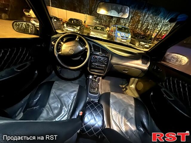 Черный Дэу Ланос, объемом двигателя 1.5 л и пробегом 292 тыс. км за 2300 $, фото 6 на Automoto.ua