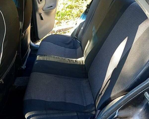 Черный Дэу Ланос, объемом двигателя 1.5 л и пробегом 365 тыс. км за 2000 $, фото 6 на Automoto.ua