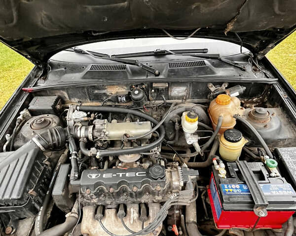 Черный Дэу Ланос, объемом двигателя 1.5 л и пробегом 200 тыс. км за 2000 $, фото 8 на Automoto.ua