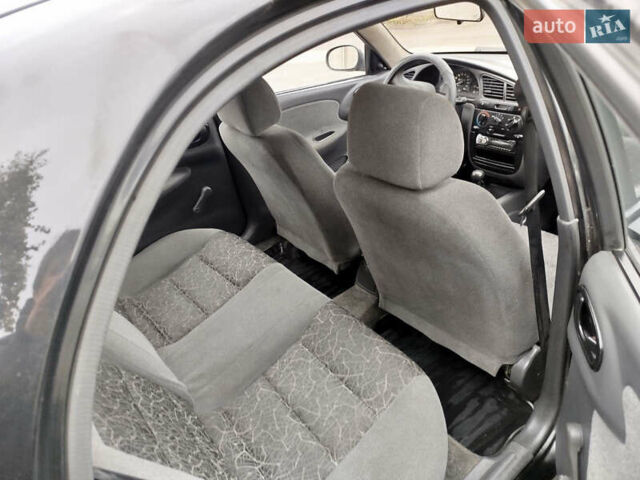 Черный Дэу Ланос, объемом двигателя 1.5 л и пробегом 350 тыс. км за 1800 $, фото 8 на Automoto.ua