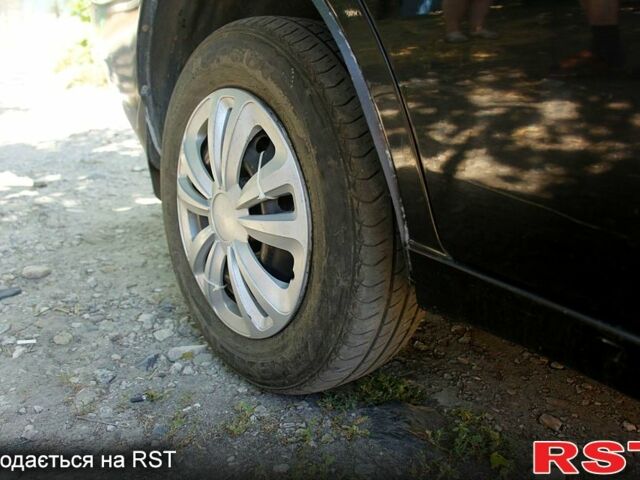 Черный Дэу Ланос, объемом двигателя 1.6 л и пробегом 104 тыс. км за 3000 $, фото 1 на Automoto.ua