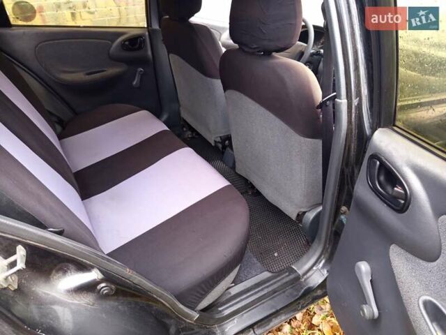 Черный Дэу Ланос, объемом двигателя 1.5 л и пробегом 180 тыс. км за 2300 $, фото 6 на Automoto.ua