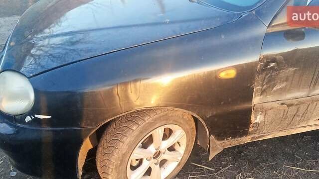 Черный Дэу Ланос, объемом двигателя 1.5 л и пробегом 238 тыс. км за 1950 $, фото 4 на Automoto.ua