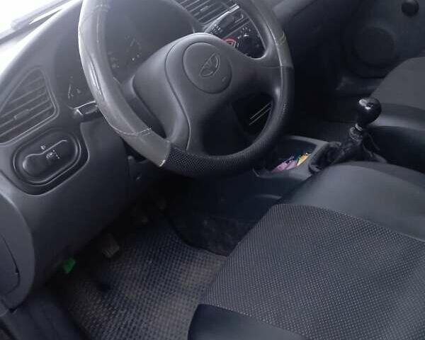 Чорний Деу Ланос, об'ємом двигуна 1.5 л та пробігом 184 тис. км за 3000 $, фото 2 на Automoto.ua