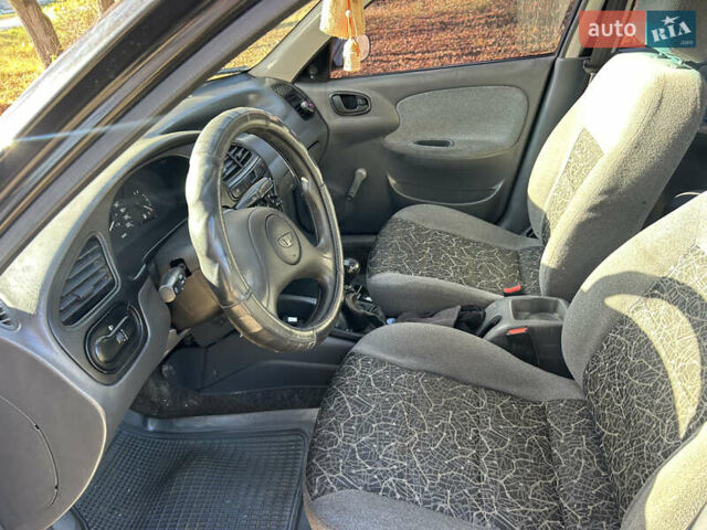 Черный Дэу Ланос, объемом двигателя 1.5 л и пробегом 152 тыс. км за 1550 $, фото 5 на Automoto.ua