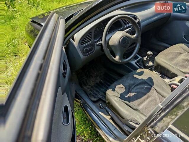 Чорний Деу Ланос, об'ємом двигуна 1.5 л та пробігом 100 тис. км за 2400 $, фото 4 на Automoto.ua