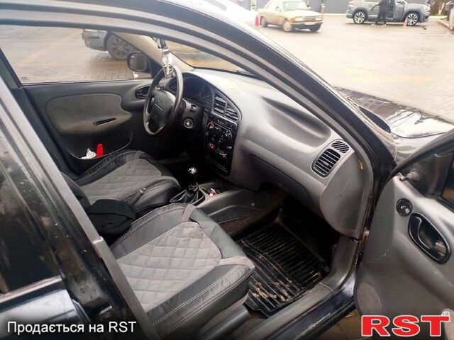 Черный Дэу Ланос, объемом двигателя 1.6 л и пробегом 200 тыс. км за 2100 $, фото 4 на Automoto.ua