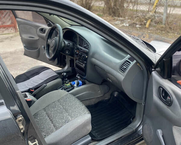 Чорний Деу Ланос, об'ємом двигуна 1.4 л та пробігом 180 тис. км за 1800 $, фото 20 на Automoto.ua