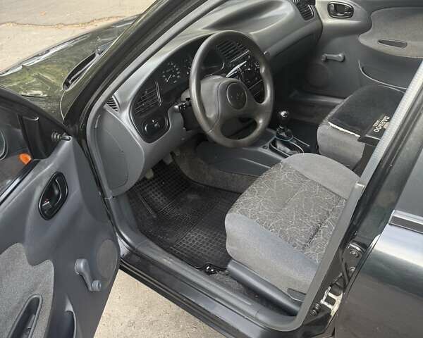 Черный Дэу Ланос, объемом двигателя 1.5 л и пробегом 99 тыс. км за 1650 $, фото 3 на Automoto.ua