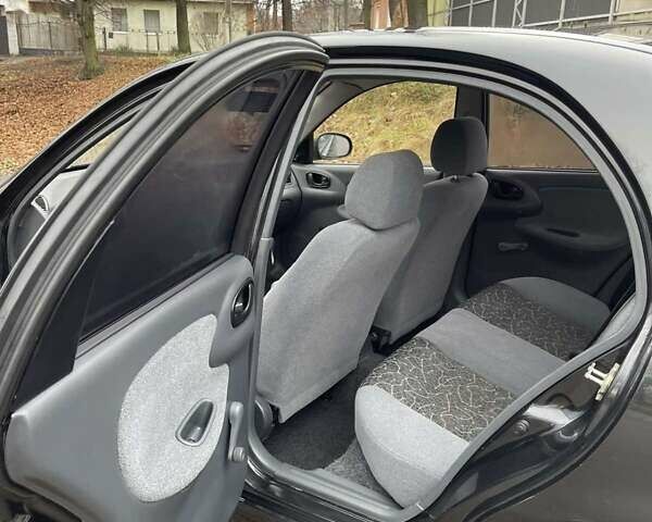 Чорний Деу Ланос, об'ємом двигуна 1.5 л та пробігом 167 тис. км за 2999 $, фото 5 на Automoto.ua