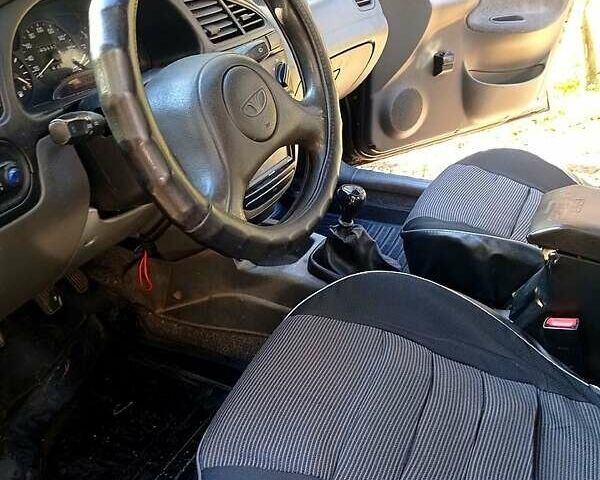 Черный Дэу Ланос, объемом двигателя 1.5 л и пробегом 365 тыс. км за 2000 $, фото 4 на Automoto.ua