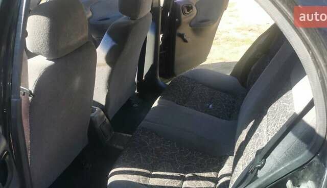 Черный Дэу Ланос, объемом двигателя 1.3 л и пробегом 160 тыс. км за 2000 $, фото 16 на Automoto.ua