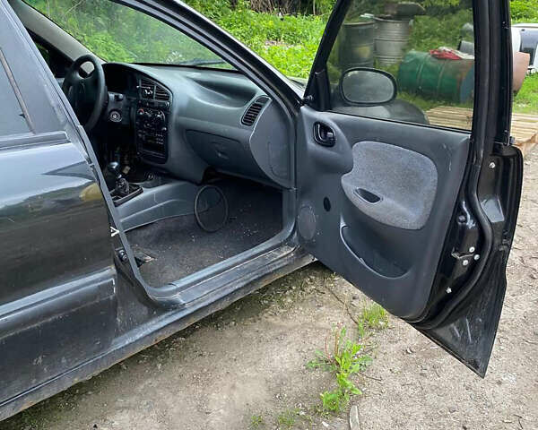 Черный Дэу Ланос, объемом двигателя 0 л и пробегом 250 тыс. км за 2000 $, фото 9 на Automoto.ua