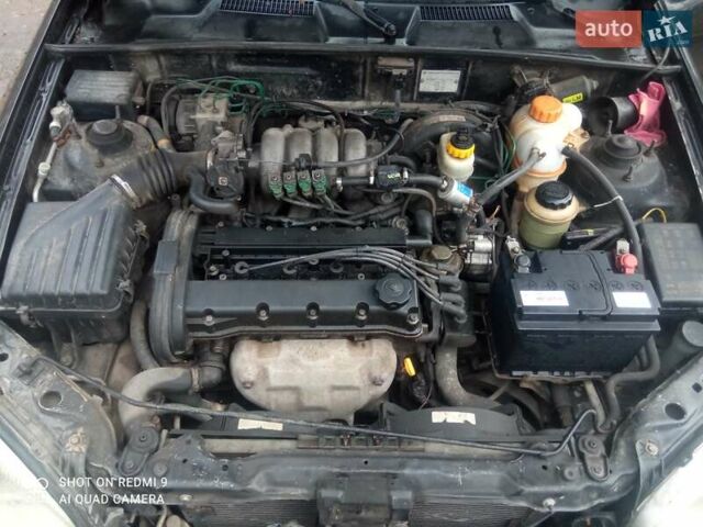 Чорний Деу Ланос, об'ємом двигуна 1.6 л та пробігом 230 тис. км за 1750 $, фото 1 на Automoto.ua