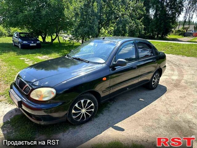 Черный Дэу Ланос, объемом двигателя 1.4 л и пробегом 250 тыс. км за 1999 $, фото 3 на Automoto.ua