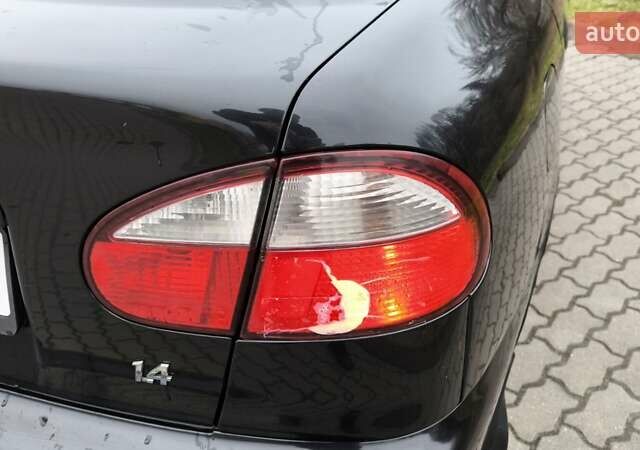Черный Дэу Ланос, объемом двигателя 1.39 л и пробегом 213 тыс. км за 2300 $, фото 11 на Automoto.ua