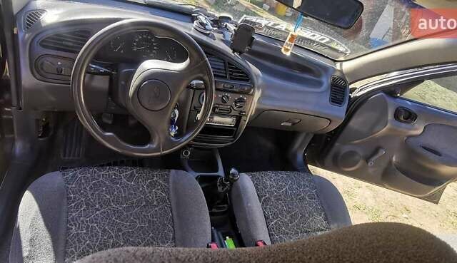 Черный Дэу Ланос, объемом двигателя 1.3 л и пробегом 160 тыс. км за 2000 $, фото 14 на Automoto.ua