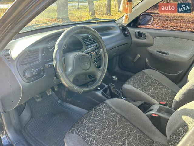Черный Дэу Ланос, объемом двигателя 1.5 л и пробегом 152 тыс. км за 1550 $, фото 6 на Automoto.ua