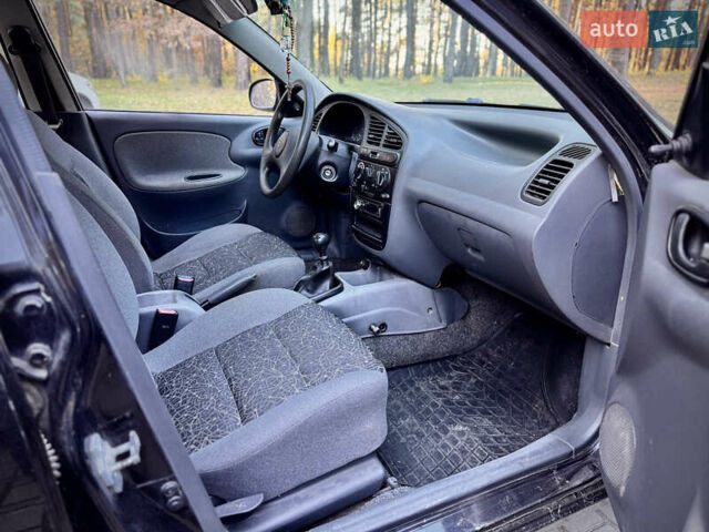 Черный Дэу Ланос, объемом двигателя 1.5 л и пробегом 97 тыс. км за 2850 $, фото 2 на Automoto.ua
