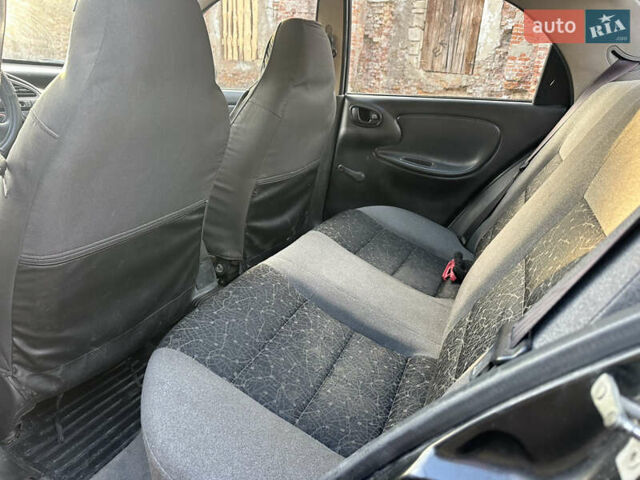 Черный Дэу Ланос, объемом двигателя 1.4 л и пробегом 220 тыс. км за 1450 $, фото 6 на Automoto.ua