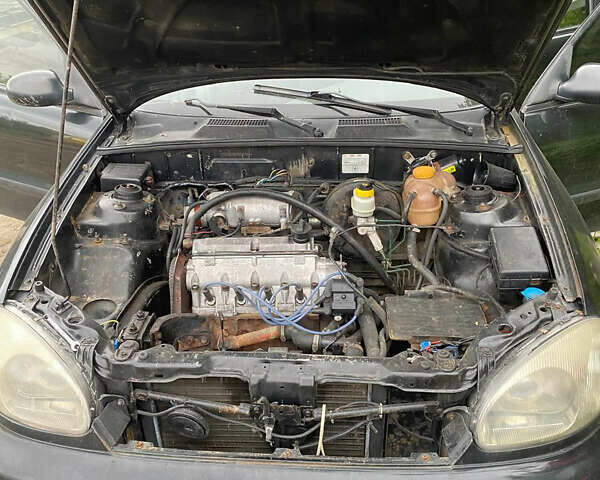 Черный Дэу Ланос, объемом двигателя 0 л и пробегом 250 тыс. км за 2000 $, фото 14 на Automoto.ua