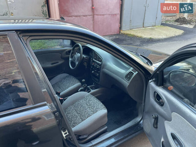 Черный Дэу Ланос, объемом двигателя 1.4 л и пробегом 233 тыс. км за 2500 $, фото 27 на Automoto.ua