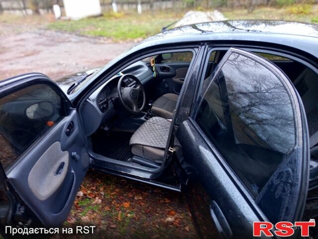 Чорний Деу Ланос, об'ємом двигуна 1.4 л та пробігом 150 тис. км за 1300 $, фото 1 на Automoto.ua