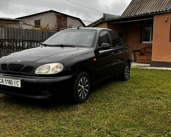 Черный Дэу Ланос, объемом двигателя 1.5 л и пробегом 200 тыс. км за 2000 $, фото 1 на Automoto.ua