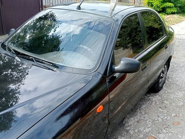 Черный Дэу Ланос, объемом двигателя 1.5 л и пробегом 213 тыс. км за 2400 $, фото 1 на Automoto.ua