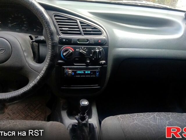 Черный Дэу Ланос, объемом двигателя 1.5 л и пробегом 276 тыс. км за 2000 $, фото 4 на Automoto.ua