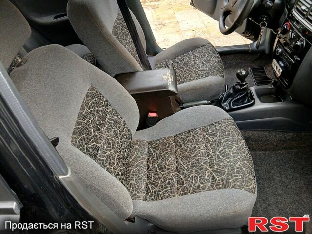 Черный Дэу Ланос, объемом двигателя 1.4 л и пробегом 144 тыс. км за 2100 $, фото 6 на Automoto.ua