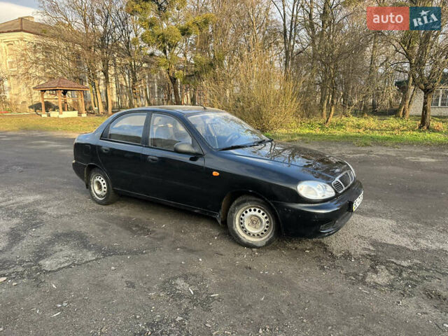 Черный Дэу Ланос, объемом двигателя 1.4 л и пробегом 220 тыс. км за 1450 $, фото 5 на Automoto.ua