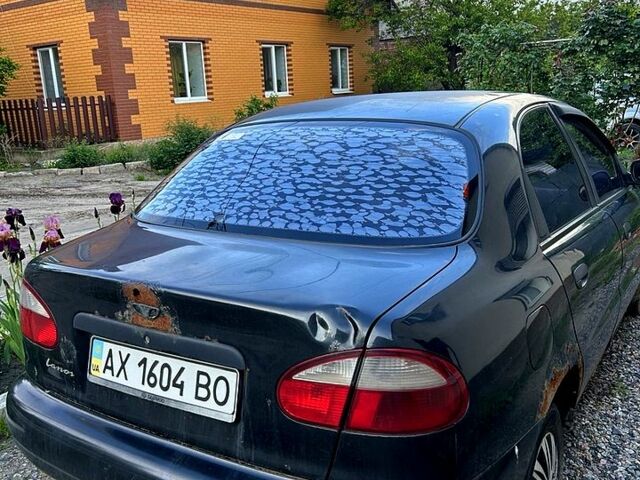 Черный Дэу Ланос, объемом двигателя 1.5 л и пробегом 209 тыс. км за 800 $, фото 1 на Automoto.ua