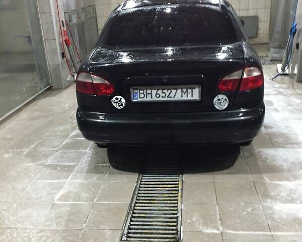 Черный Дэу Ланос, объемом двигателя 1.6 л и пробегом 333 тыс. км за 1930 $, фото 2 на Automoto.ua