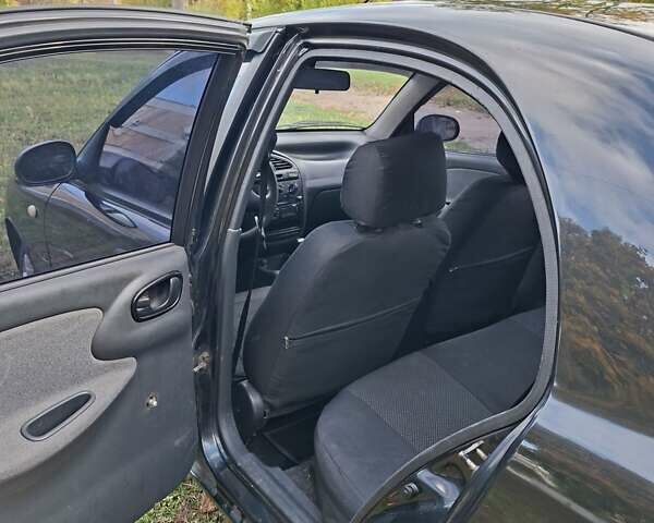 Чорний Деу Ланос, об'ємом двигуна 1.5 л та пробігом 219 тис. км за 1900 $, фото 5 на Automoto.ua