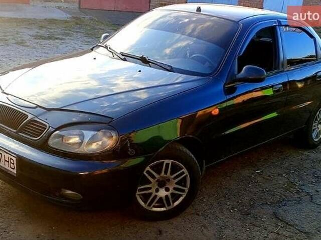 Черный Дэу Ланос, объемом двигателя 1.39 л и пробегом 233 тыс. км за 2200 $, фото 3 на Automoto.ua